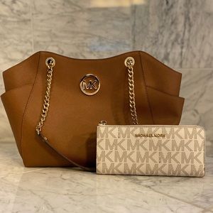 Medium Michael Kors brown/tan shoulder bag with tan/off white wallet.
